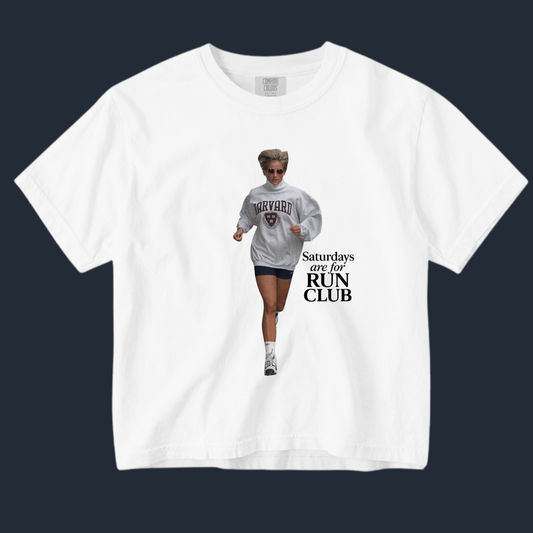 White t-shirt with a graphic of a person running and text on a black background